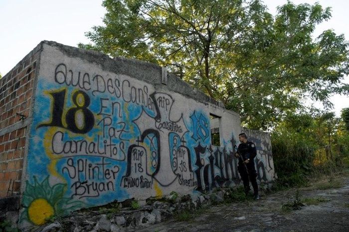 Graffiti marking gang territory in an abandoned neighborhood of San Martin, El Salvador in November 2018