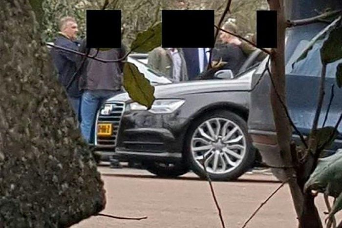 Alleged Russian agents stand in a parking lot near the OPCW in The Hague in April