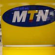 A customer leaves an MTN shop in Johannesburg April 10, 2012. REUTERS/Siphiwe Sibeko
