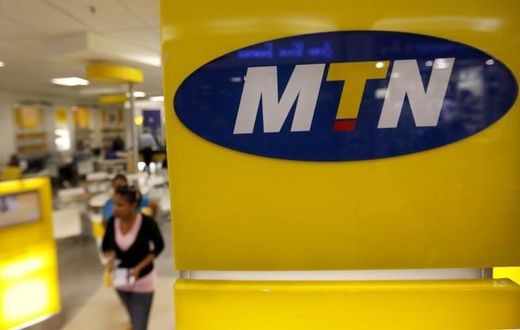 A customer leaves an MTN shop in Johannesburg April 10, 2012. REUTERS/Siphiwe Sibeko