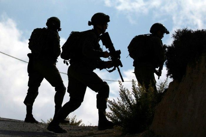 Israeli soldiers pictured following clashes between Israeli settlers from the settlement of Yitzhar and Palestinians from nearby Urif village, south of Nablus in the West Bank, on October 10, 2018