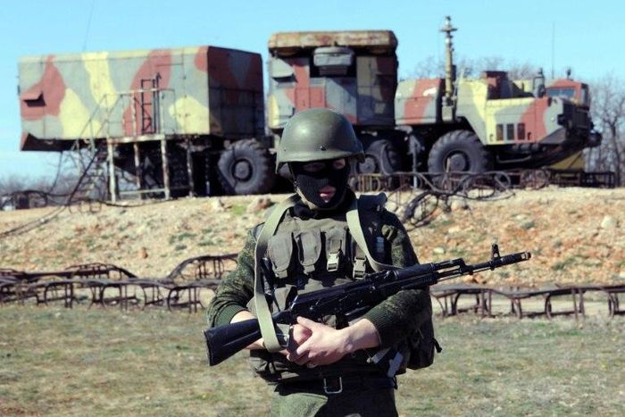 A Russian soldier stands guard in front of an S300 surface-to-air missile battery like those delivered to Syria after a September Israeli strike during which a Russian aircraft was accidentally downed