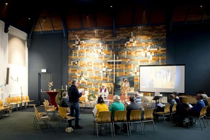 A church in the Haque is holding non-stop services to stop Dutch authorities serving a deportation order on an Armenian family seeking asylum in the Netherlands .