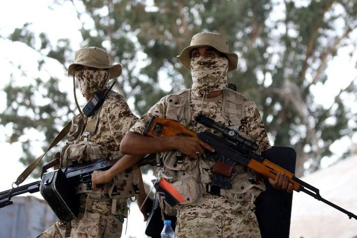 Libyan forces loyal to the internationally recognised government keep watch from a position south of Tripoli on September 25, 2018