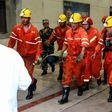Picture taken on October 21 shows rescuers transferring an injured miner after a mining accident in Yuncheng County in China's eastern Shandong province