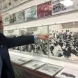 Johnny Lopez de la Cruz, a Cuban who is president of the Bay of Pigs Veterans Association, points to himself in a picture featured in the Brigade 2506 Museum in Little Havana, Miami