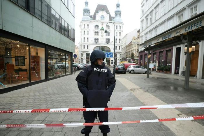 A police officer stands guard in central Vienna after a shooting left one dead. Police ruled out a terrorist link.