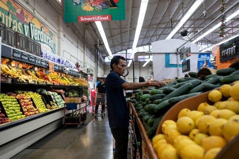 Edwin Garcia, a 27-year-old auto mechanic from Honduras, has found work at a supermarket in Mexico, after leaving home because he was too poor to even buy milk for his baby daughter