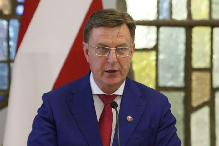 Latvian Prime Minister Maris Kucinskis, pictured August 2018, vowed to "adhere to parliament's decision" regarding the UN Global Compact for Migration, which his parliament has voted against