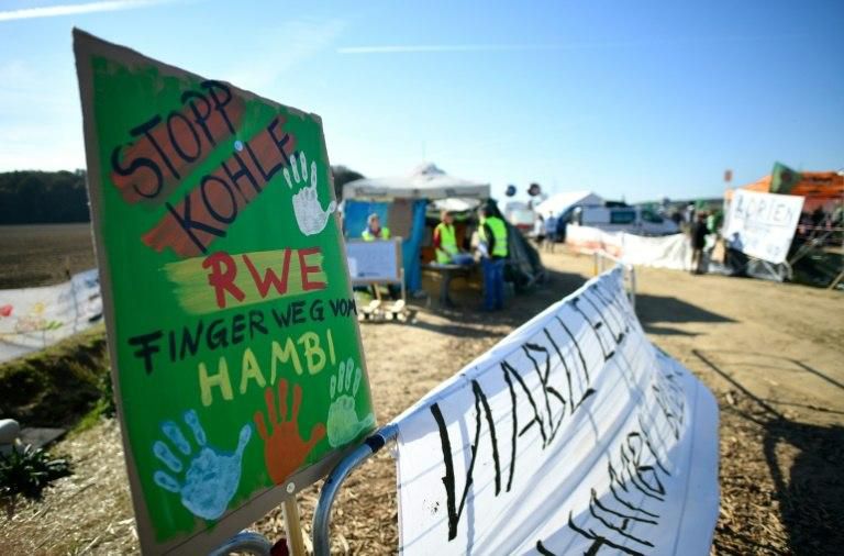 "Stop coal - RWE hands off Hambi" reads a poster close to the forest, whose days had appeared numbered before a court ruling which prompted a Greenpeace spokeswoman to hail what she termed a first step in the battle to phase out coal
