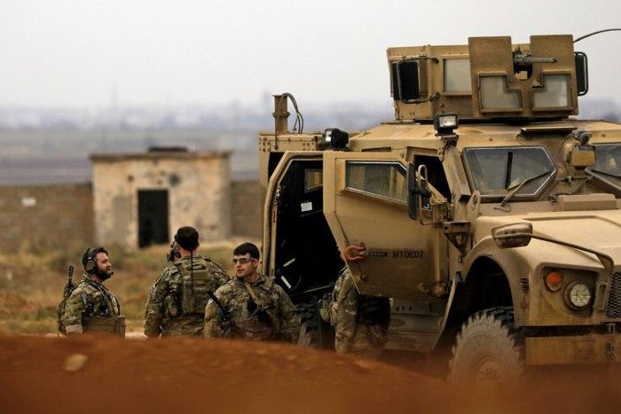 Members of the Syrian Democratic Forces (SDF) and US soldiers patrol the Kurdish-held town of Al-Darbasiyah in northeastern Syria bordering Turkey on November 4, 2018