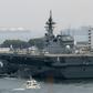 Japan's new five-year defence plan calls for the military to upgrade two existing "helicopter carriers" so that they will also be able to launch fighter jets