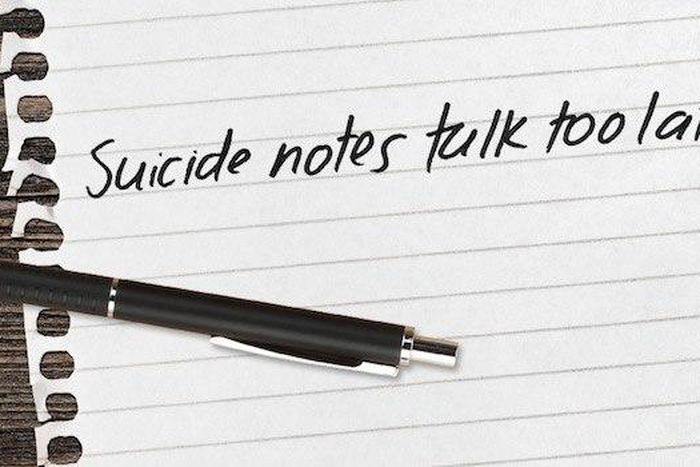 Police keep away a death note written by a man who hangs himself at their barracks.