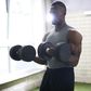 ___9181775___2018___12___9___9___man-lifting-dumbbells-in-gym-royalty-free-image-1032071022-1543875123