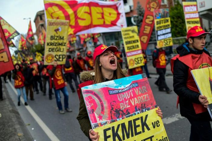 Protesters march in a demonstration against the Turkish government's economic policies in Istanbul