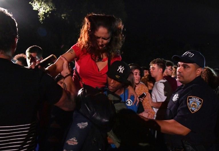 A fallen security barrier caused panic and hundreds of spectators raced to leave after they thought they heard gunshots