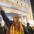 A man gestures as he and other fellow protesters get ready for the anti-government march in front of the VMRO-DPMNE headquarters in Skopje