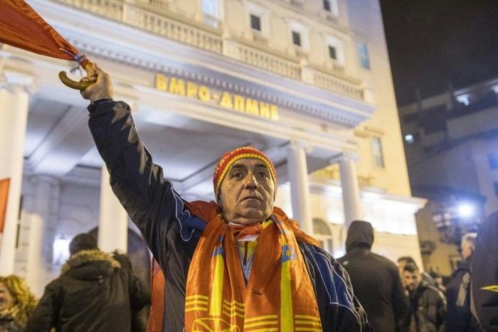 A man gestures as he and other fellow protesters get ready for the anti-government march in front of the VMRO-DPMNE headquarters in Skopje