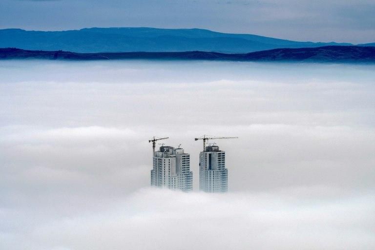Some of the highest buildings in the Skopje area peak above the clouds in an area where the air pollution can practically paralyse the Macedonian capital