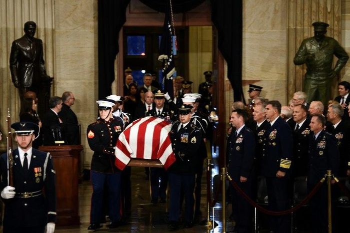 The casket bearing the remains of former US President George H.W. Bush arrives at the US Capitol during the State Funeral in Washington, DC, December 3, 2018