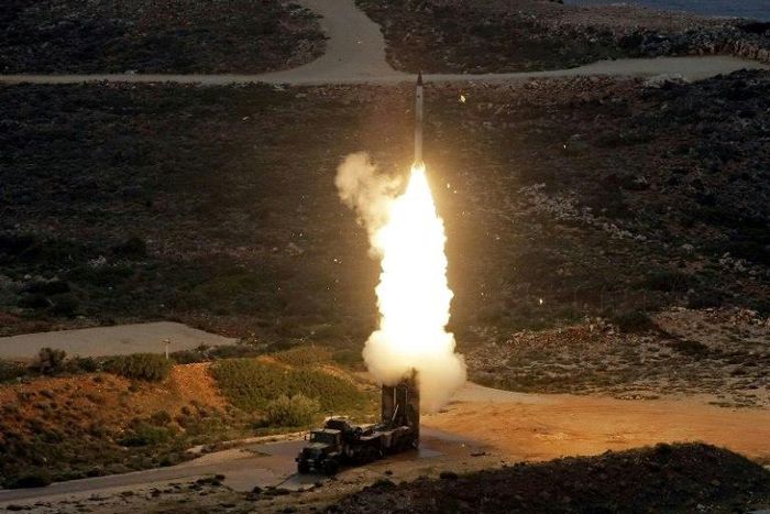 Greek troops on exercise fire an S-300 surface-to-air missile like those delivered to Syria after a September Israeli strike during which a Russian aircraft was accidentally downed