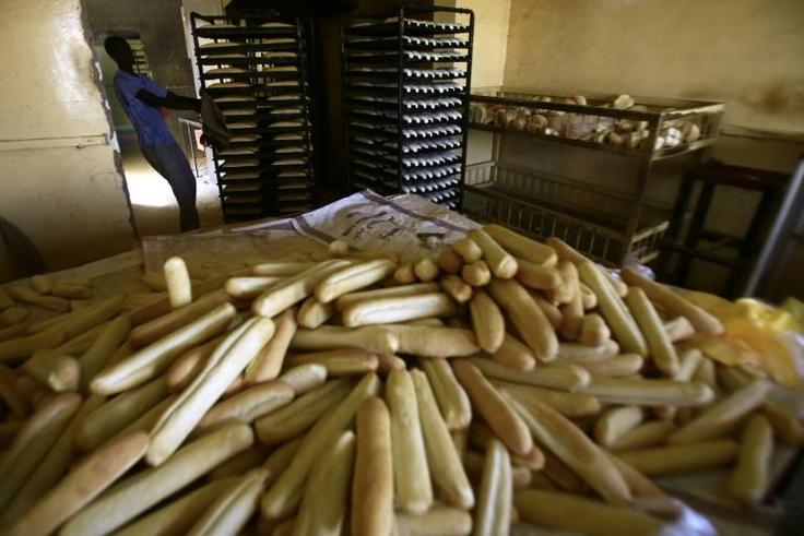 Eight people have been killed in Sudan in clashes with riot police during protests over the rising price of bread
