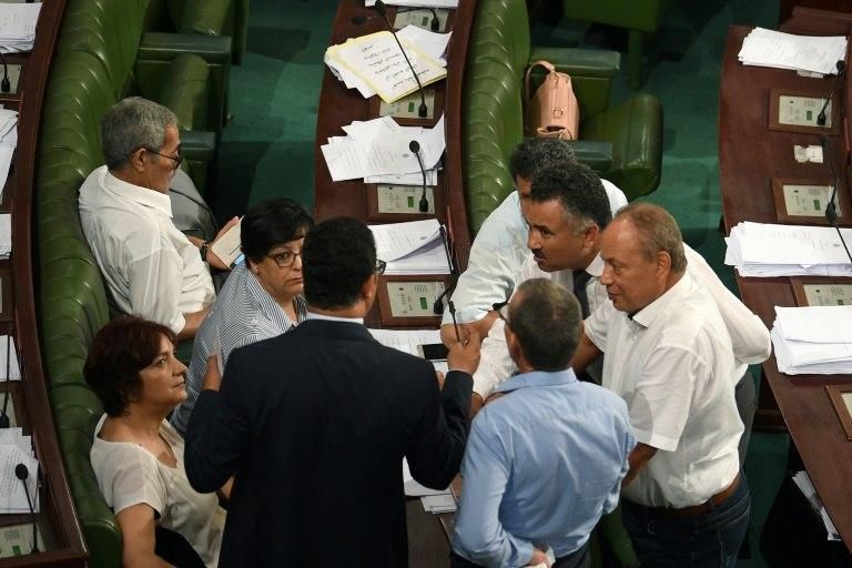 Lawmakers huddle to discuss a confidence bill in the Tunisian parliament on July 28, 2018
