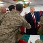 US President Donald Trump and First Lady Melania Trump greet members of the US military during an unannounced trip to Al Asad Air Base in Iraq on December 26, 2018