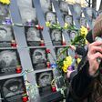 A woman cries at a memorial for the "Heavenly Hundred" who died during protests in Kiev's Maidan Square five years ago