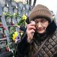 A woman cries at a memorial for the "Heavenly Hundred" who died during protests in Kiev's Maidan Square five years ago