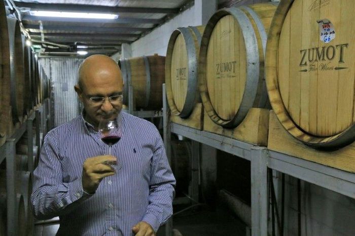 Omar Zumot, manager of Amman's Saint George winery and who studied winemaking in France, samples a glass as two Jordanian families look to revive an age-old tradition that some suggest has Biblical heritage