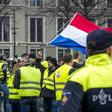 Protestors wearing yellow vests demonstrate in The Hague