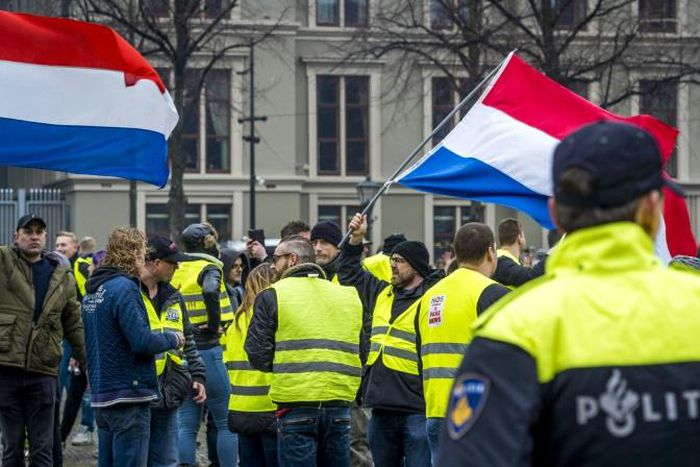 Protestors wearing yellow vests demonstrate in The Hague
