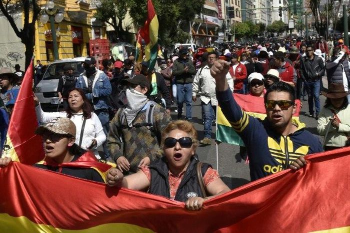 People march against the nomination of Bolivian President Evo Morales as candidate for reelection for the October 2019 elections, during a national strike, in La Paz, on December 6, 2018