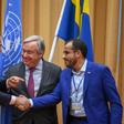 Yemen's foreign minister Khaled al-Yamani (L) and rebel negotiator Mohammed Abdelsalam (R) shake hands under the eyes of UN Secretary General Antonio Guterres (C), at Johannesberg Castle in Rimbo, Sweden, on December 13, 2018