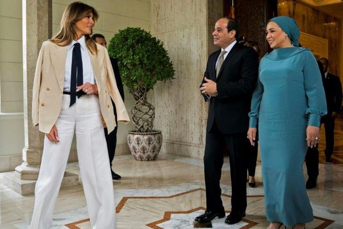 US First Lady Melania Trump (L) is welcomed by Egyptian President Abdel Fattah al-Sisi (C) and his wife Intissar Amer (R) upon arrival at the Presidential palace in the Egyptian capital Cairo
