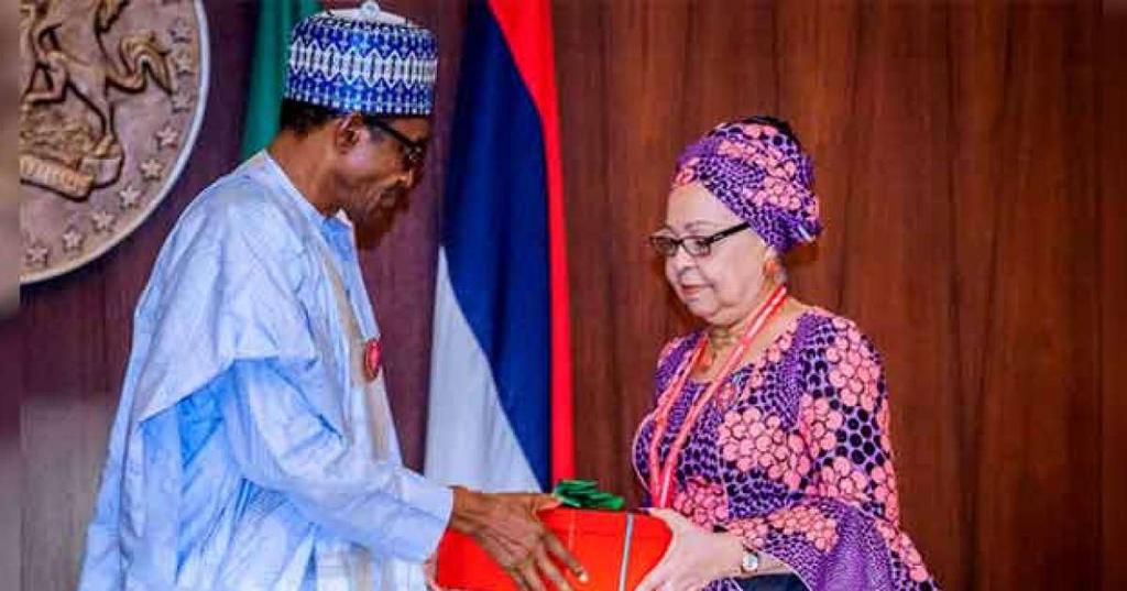 President Muhammdu Buhari receiving the report of the Tripartite Committee on the Review of National Minimum Wage from the Committee Chairman, Mrs Amal Pepple, at the State House on November 6, 2018.