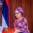 President Muhammdu Buhari receiving the report of the Tripartite Committee on the Review of National Minimum Wage from the Committee Chairman, Mrs Amal Pepple, at the State House on November 6, 2018.