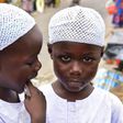 Twin brothers Salim and Mahamadou Cisse, just five years old, beg at the busy market of Abobo, a suburb of Ivory Coast's commercial capital Abidjan