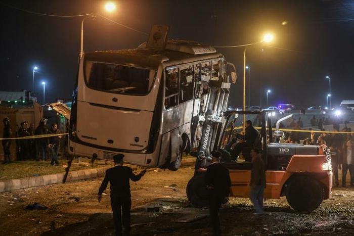 This picture taken on December 28, 2018 shows the tourist bus hit by a deadly roadside bomb blast being towed away from the scene in Giza just south of the Egyptian capital Cairo