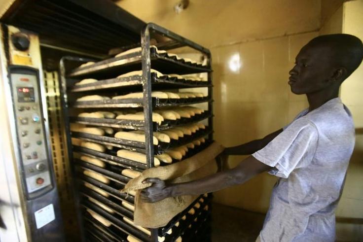 A Sudanese man works at a bakery in the capital Khartoum on January 5, 2018