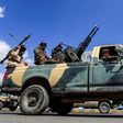 A Yemeni soldier loyal to the Shiite Huthi rebels mans a turret in the back of a pickup truck as others ride during a military parade in the capital Sanaa on October 16, 2018 to show support against the Saudi-led intervention in the country