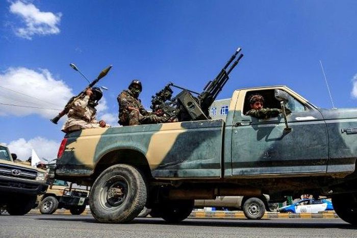 A Yemeni soldier loyal to the Shiite Huthi rebels mans a turret in the back of a pickup truck in the capital Sanaa on October 16, 2018: the UN says it is inspecting a shipment of thousands of AK-47 rifles intercepted en route to the conflict zone