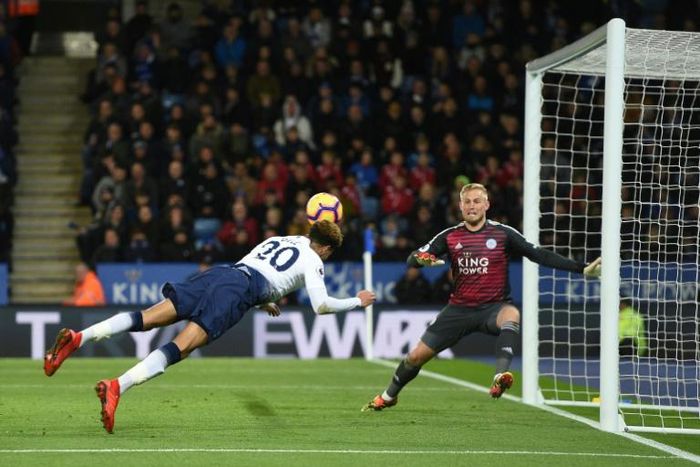 Diving Dele: Dele Alli (left) scored Tottenham's second goal with a diving header in a 2-0 win at Leicester