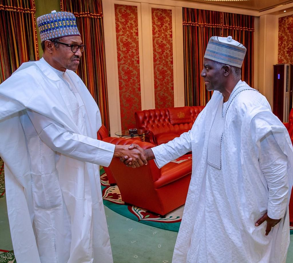 President Muhammadu Buhari shakes hands with the Director-General of the Department of State Services (DSS), Yusuf Magaji Bichi