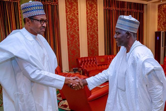 President Muhammadu Buhari shakes hands with the Director-General of the Department of State Services (DSS), Yusuf Magaji Bichi