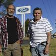 Carlos Propato (L) and Pedro Troiani, former workers of Ford and former political prisoner, pose during an interview with AFP outside Ford’s General Pacheco plant in Buenos Aires on March 16, 2018