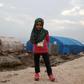 Maya Merhi poses for a picture in the Serjilla camp for internally displaced persons in northwestern Syria next to Bab al-Hawa border crossing with Turkey, on December 9, 2018