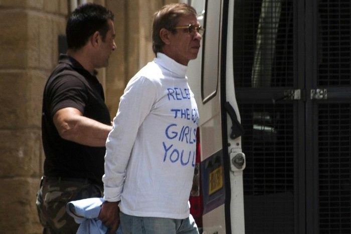 Egyptian Seif al-Din Mohamed Mostafa is escorted to an extradition hearing in the Cypriot capital Nicosia on May 13, 2016