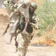 Old man rescued by soldier during a shootout between troops and Boko Haram terrorists in Gobara, Gwoza local government area of Borno state